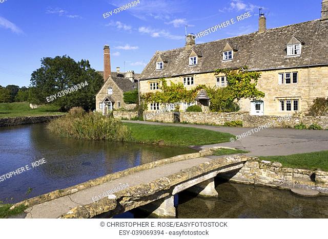 England, Gloucestershire, Cotswolds, idyllic old stone cottages at Lower Slaughter in autumn sunshine