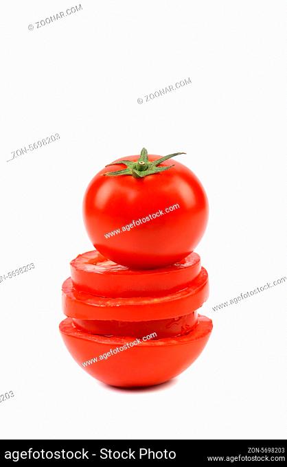Tomato is located on stack of slices. White background