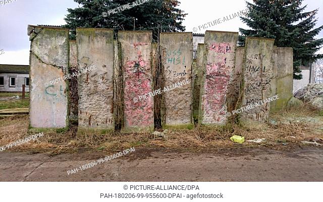 Concrete pieces of the Berlin Wall standing on the grounds of an agricultural enterprise in Wischershausen, Germany, 01 Febuary 2018