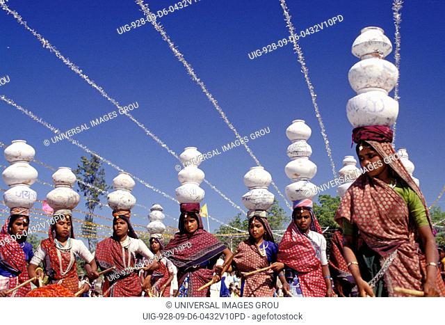 India, Rajasthan, Dungarpur. Women Carrying Pots On Their Heads, At Vagad Festival