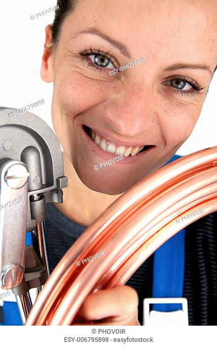 Plumber with copper pipe and bending tool
