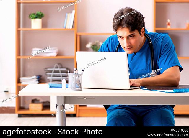 Young handsome doctor radiologyst working in clinic
