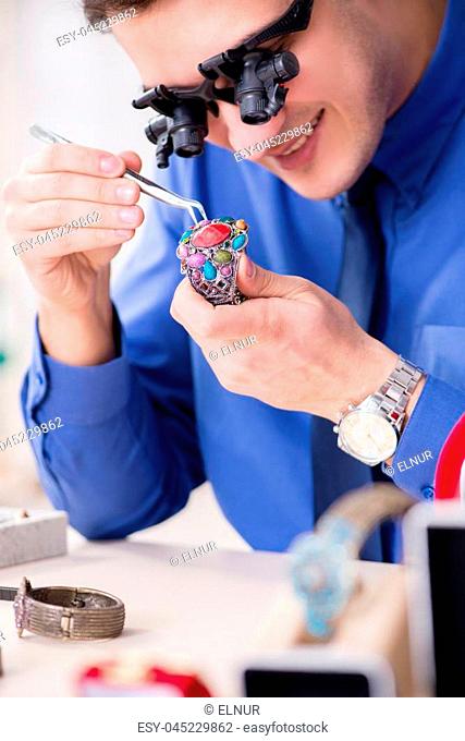 Jeweler working with luxury jewelry in the workshop
