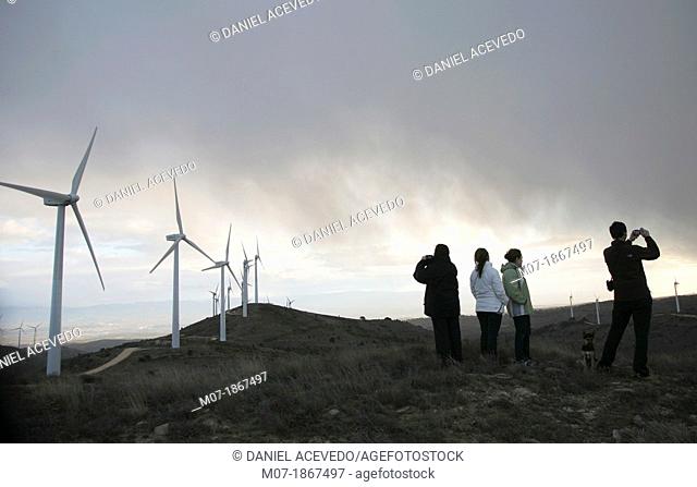 Photographer taking beautiful sunset pictures by Eolic park, wind power, wind energi, Codes mountains, Navarra, Spain, Europe