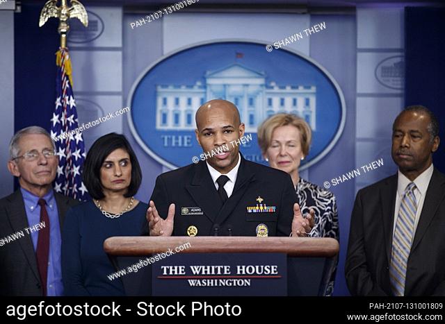 Surgeon General of the United States Jerome Adams, with members of the coronavirus taskforce, responds to a question from the news media during a COVID-19...