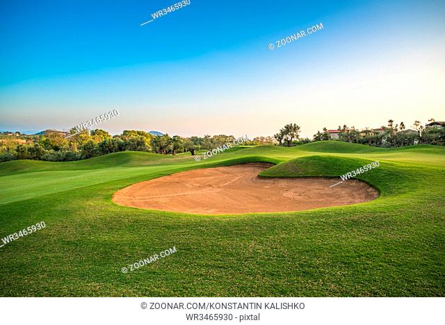 Heart shape sand bunker on the green golf course
