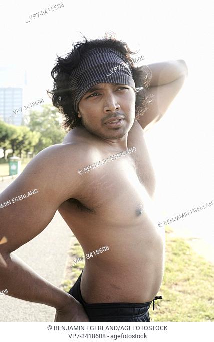 Strong muscular-built shirtless Indian man