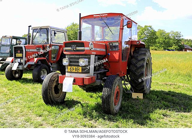 Classic Massey-Ferguson Multi-Power tractors, 188 and far left 575 on Kimito Traktorkavalkad, Tractor Cavalcade. Kimito, Finland - July 7, 2018