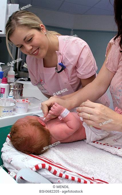 INFANT HYGIENE<BR>Photo essay from hospital.<BR>Newborn care in the maternity ward supervised by a nurse