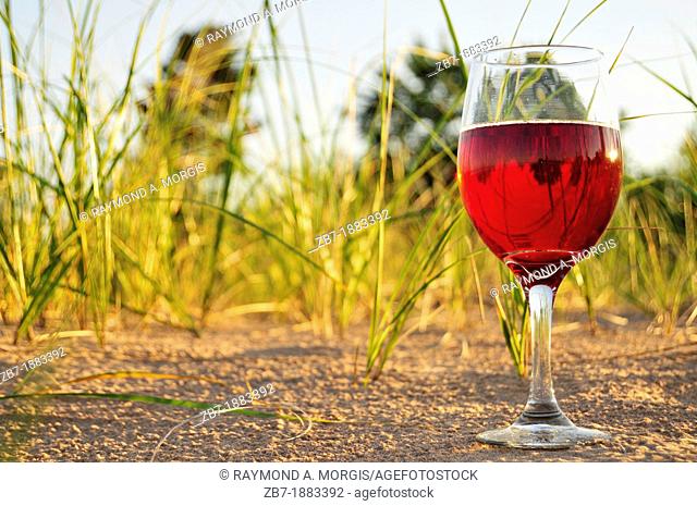 Close-Up Of Red Wine On The Beach