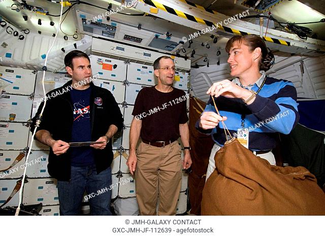 Astronauts Gregory E. Chamitoff (left), Expedition 17 flight engineer; Donald R. Pettit and Heidemarie M. Stefanyshyn-Piper, both STS-126 mission specialists