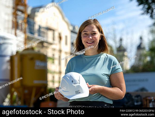 12 August 2022, Saxony, Plauen: Yvonne Magwas (CDU), Vice President of the German Bundestag, stands in front of the construction site of the Weisbach House in...