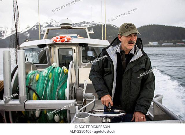 A Commercial Salmon Fisherman Drives His Bowpicker From The Steering Station On Deck Towards The Salmon Fishing Grounds On The Copper River Flats; Cordova...