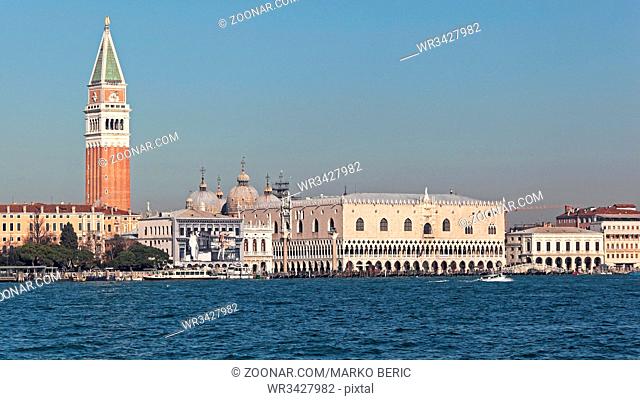 VENICE, ITALY - DECEMBER 19, 2012: Doge Palace and St Mark Tower Seaside View of Palazzo Ducale Museum and San Marco Campanile in Venice, Italy