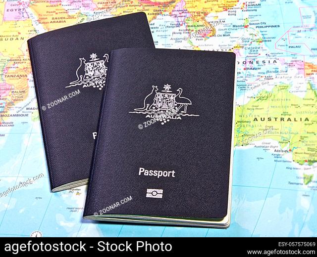 Australian Passport with the world map in the background