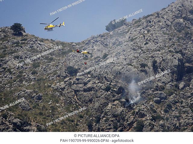 09 July 2019, Spain, Escorca: A fire in Cala Tuent, Serra de Tramuntana has burned some about 33 hectares of pine forest in Mallorca Its the first major fire...