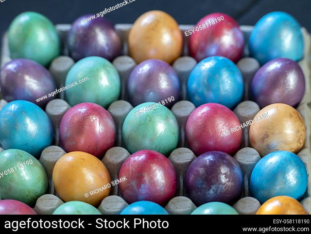 Easter background with hand painted purple, blue, green, orange