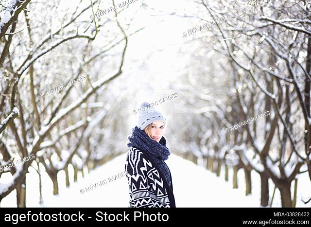 Portrait of a young woman in the snow