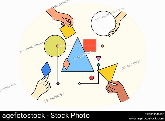 Multiethnic work team connect geometrical shapes and figures involved in teambuilding activity. Hands building system together