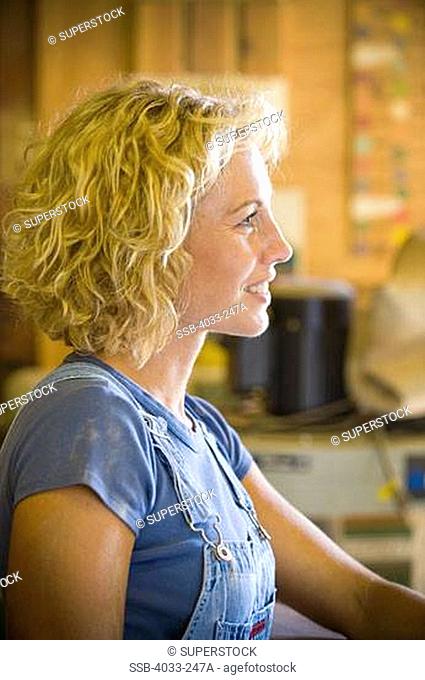 Young woman in her workshop, San Diego, California, USA