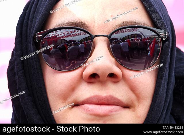 TURKEY, ANKARA - MAY 27, 2023: A woman wearing sun glasses is seen during an election campaign rally of supporters of presidential candidate Recep Tayyip...