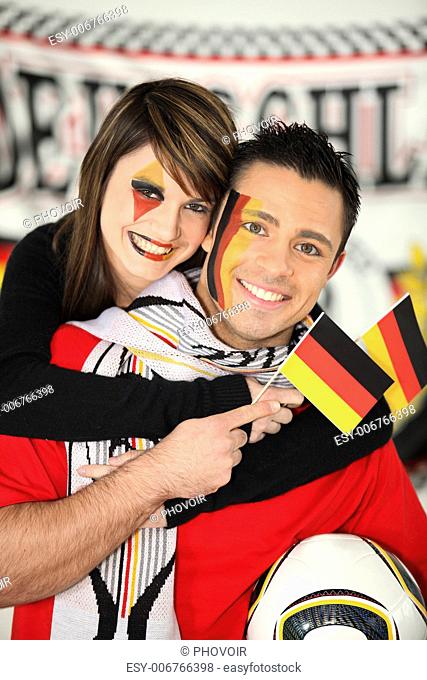 Man and woman supporting German football team