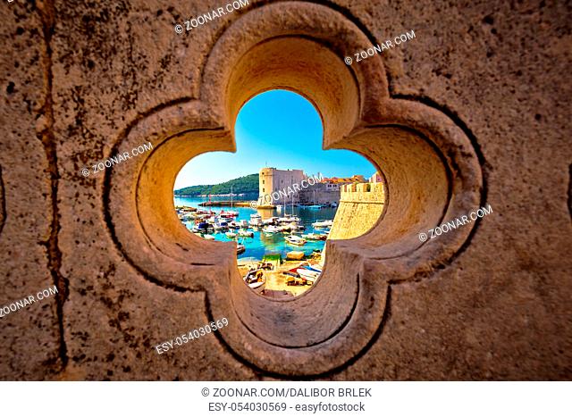 Dubrovnik harbor view from Ploce gate through stone carved detail, Dalamtia region of Croatia