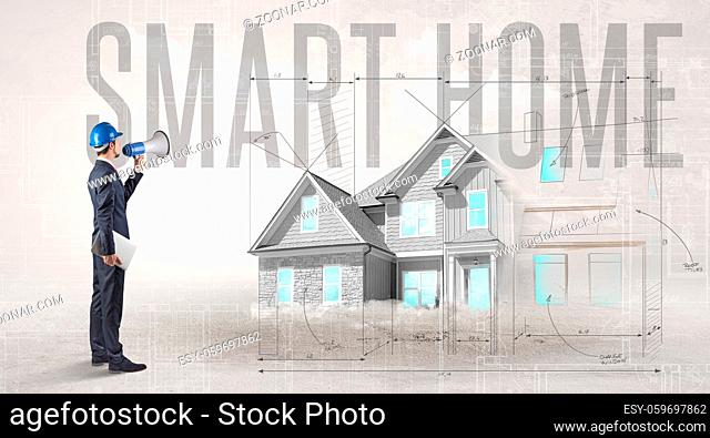 Young engineer holding blueprint with SMART HOME inscription, house planning concept