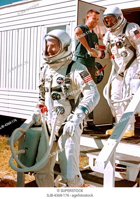 Gemini 12 prime crew, Astronauts James A. Lovell Jr. leading, command pilot, and Edwin E. Aldrin Jr., pilot, leave the suiting trailer at Launch Complex 16...