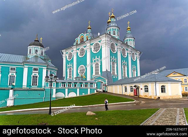 SMOLENSK, RUSSIA - APRIL 21, 2018: Uspensky cathedral against a background of dark thunderclouds. Smolensk, Russia. The end of April