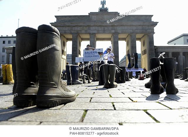 Activists with the Federal Association of German Dairy Cattle Owners (BDM) have placed rubber boots at the Brandenburg Gate during a demonstration for fair milk...
