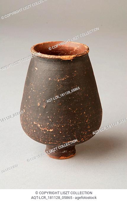 Brown Roman cup on foot, cup drinking utensils tableware holder soil find ceramic pottery paint, hand turned fried varnished Small Roman cup of red varnished...