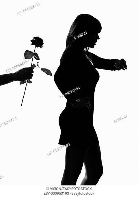 man hand offering a flower rose stylish sexy silhouette caucasian beautiful woman on studio isolated white background