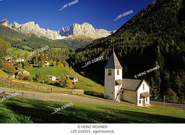 San Cipriano chapel, view to Cima Catinaccio, Dolomite Alps, South Tyrol, Italy