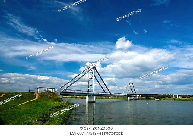 Modern steel bridge over the river