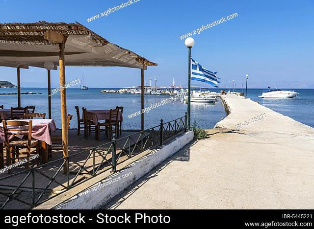 Taverna, restaurant, harbour, jetty, national flag, Kaliviotis, Lefkimmi, Corfu Island, Ionian Islands, Mediterranean Sea, Greece, Europe