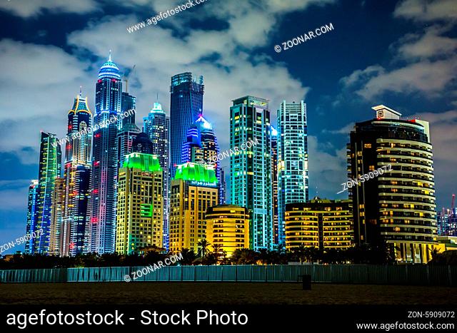 DUBAI, UAE - NOVEMBER 13: Dubai downtown night scene with city lights, luxury new high tech town in United Arab Emirates architecture on November 13
