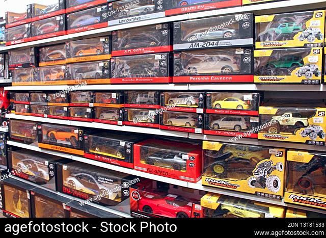 Shop toys. Toy store. Inside toy shop. Rows of shelves with toys. Children's joy. Wide selection of toys in children's store. Shop for children