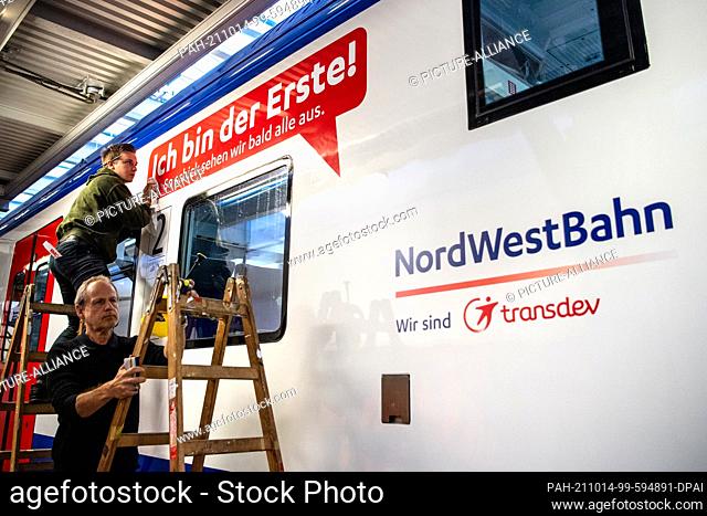 14 October 2021, Bremen, Bremerhaven: A sign reading ""I'm the first!"" is attached to a rebuilt Nordwestbahn train. A total of 34 trains of the Regio-S-Bahn...