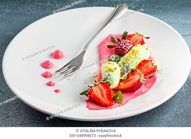 Frersh strawberries with whipped cream, ice-cream and powdered sugar