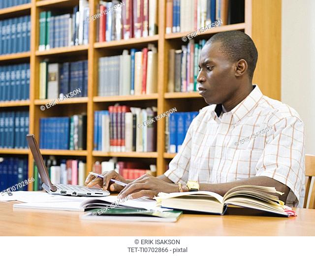 College student working in library