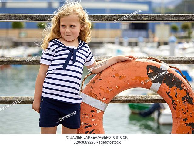 Girl in sailor clothes, Marina Urola, Santiago beach, Zumaia, Gipuzkoa, Basque Country, Spain, Europe