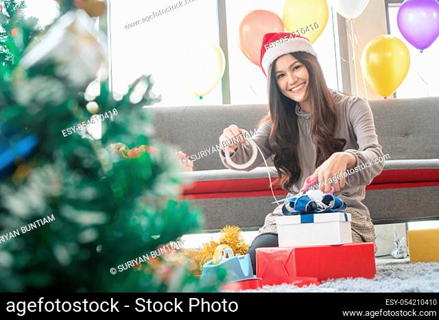 Asian women are making gifts with her bare hands at home in a fun and happy way. These gifts are prepared for her family and close relatives during the...