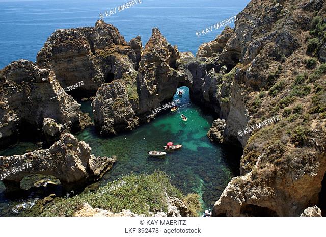 Boats and bizar rock formations, Ponta da Piedade, near Lagos, Algarve, Portugal, Europe