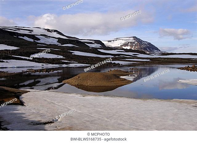 Meltwater pool and the mountain Bjolfur in the Fjardarheidi range near Seydisfjordur, Iceland, Seydisfjordur