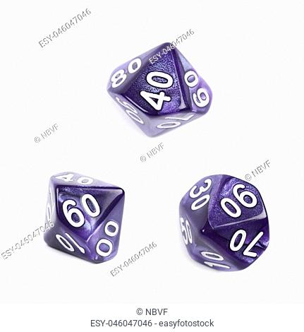 Violet roleplaying polyhedral heptagonal trapezohedron gaming plastic dice isolated over the white background, set of three different foreshortenings