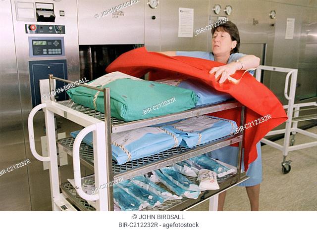 Autoclave Attendant from sterile services preparing trolley