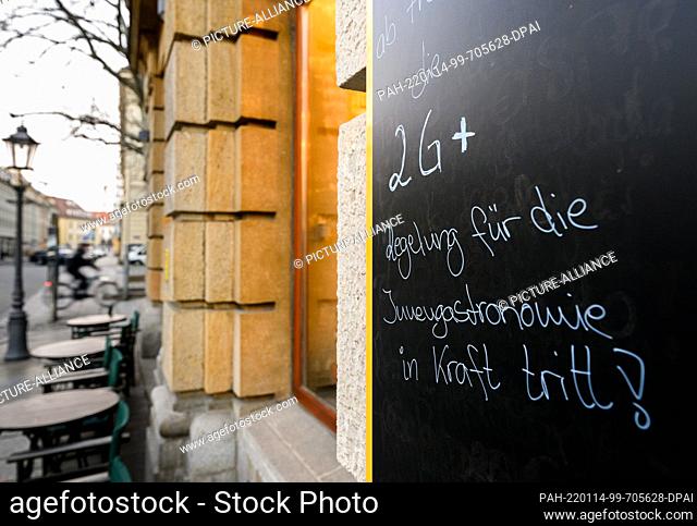 14 January 2022, Saxony, Dresden: A sign outside a cafe points out the 2G-plus rule. Saxony is relaxing its strict Corona protection measures from this Friday
