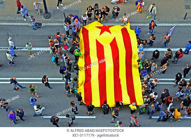 Protesters with estelada (Catalan pro-independence flag), Barcelona, Catalonia, Spain