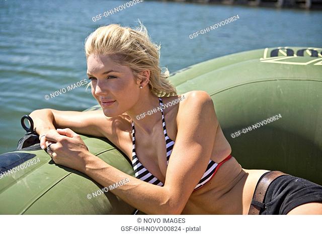 Young Woman Relaxing in Dinghy